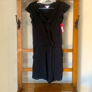 Women’s Xhiliration romper with ruffle detailing. New with tags